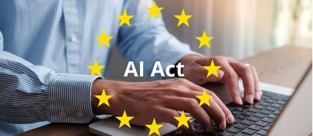 Eine Person sitzt vor einem Laptop und tippt etwas, darüber sind Sterne in einem Kreis angeordnet und darin steht AI Act.